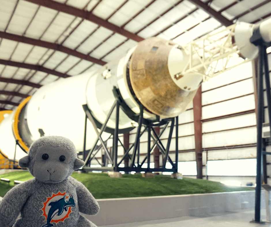 Buddy in front of the Saturn V rocket inside Space Center Houston