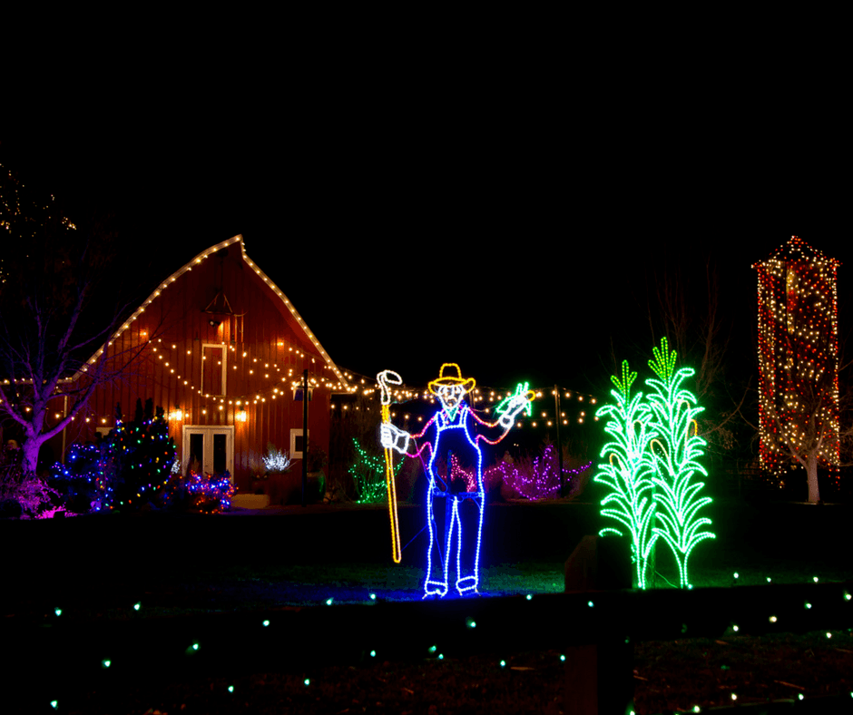 A scarecrow and house of lights at Chatfield Farms