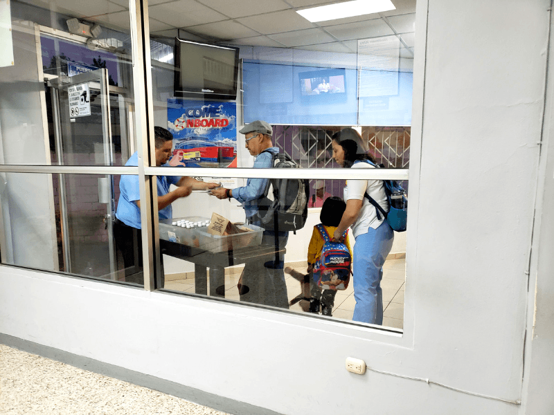 Passengers getting snacks before they board in Tegucigalpa Honduras