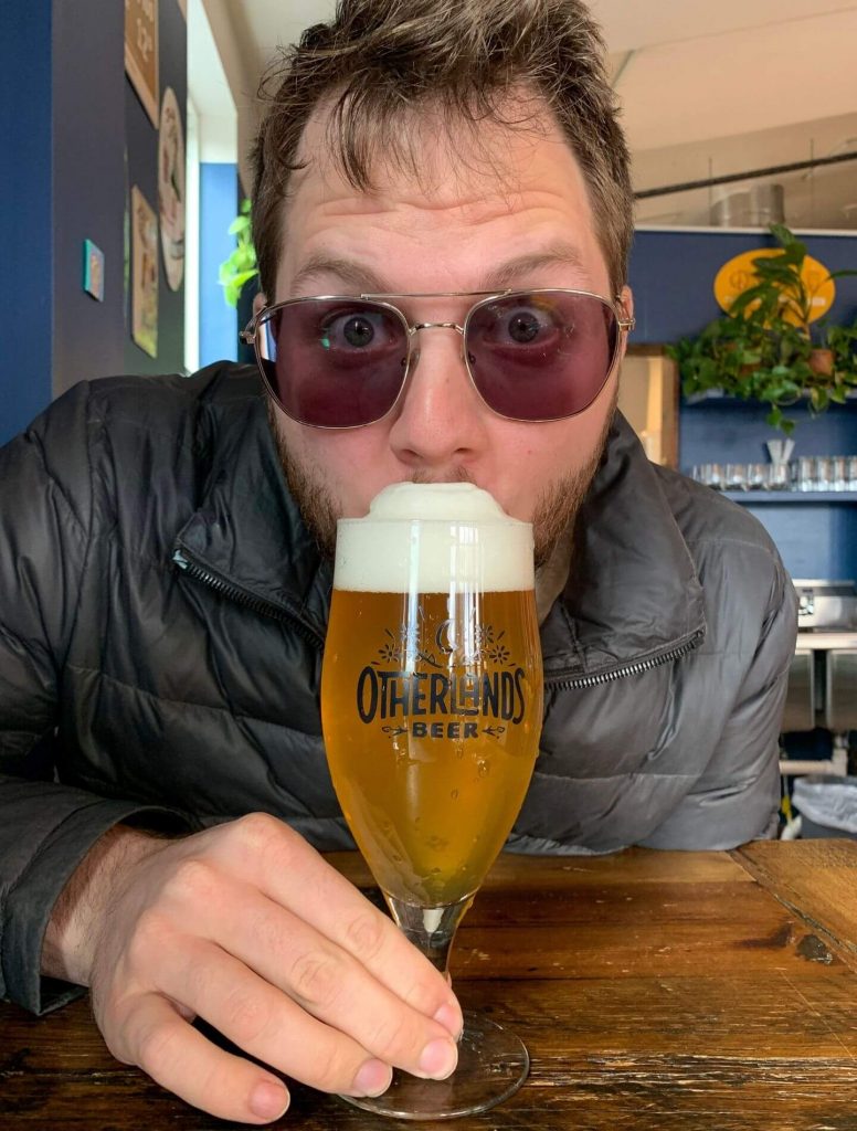 man drinking beer at Otherlands Beer