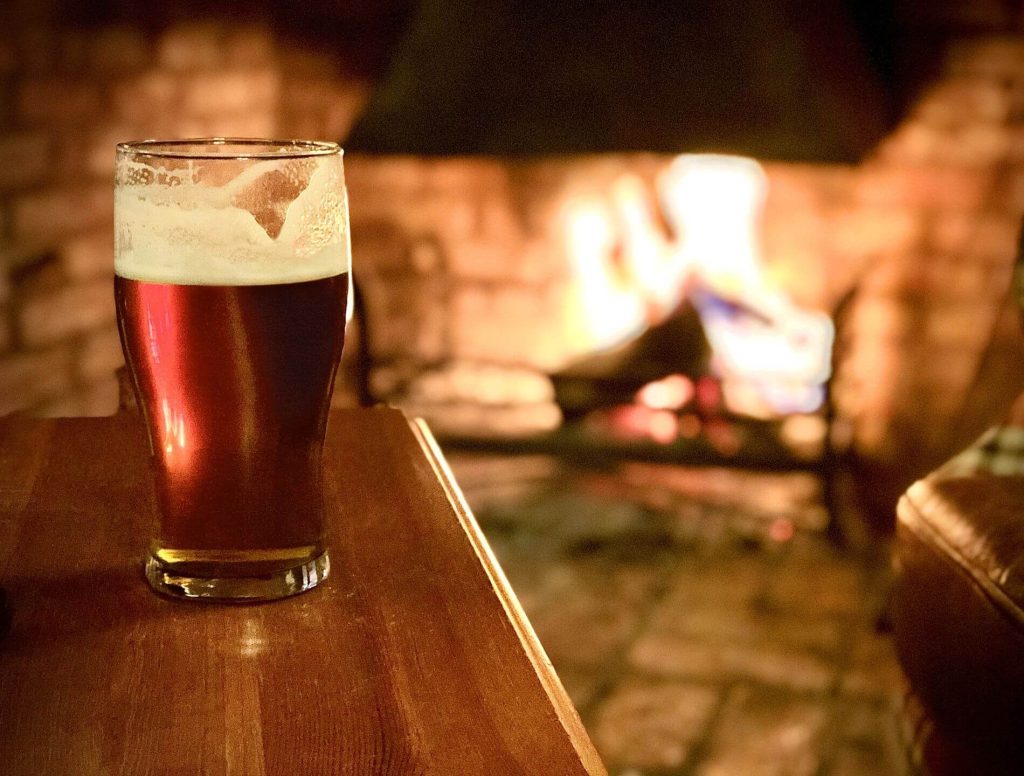 Enjoy a beer by the fire at a traditional English pub in London in winter